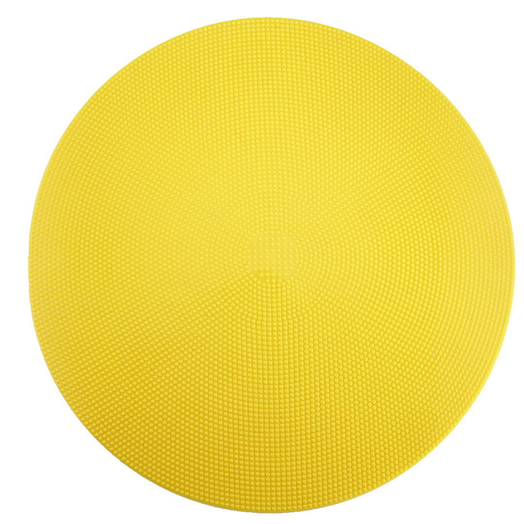 A bright yellow, circular disc with a pebbled, non-slip texture on a white background.