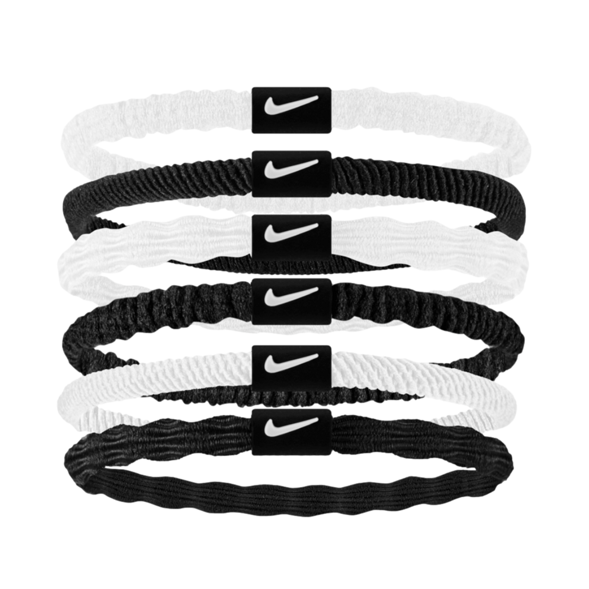 Six stacked Nike hair elastics in alternating white and black. Each band features a central black plastic tab with a white swoosh logo.