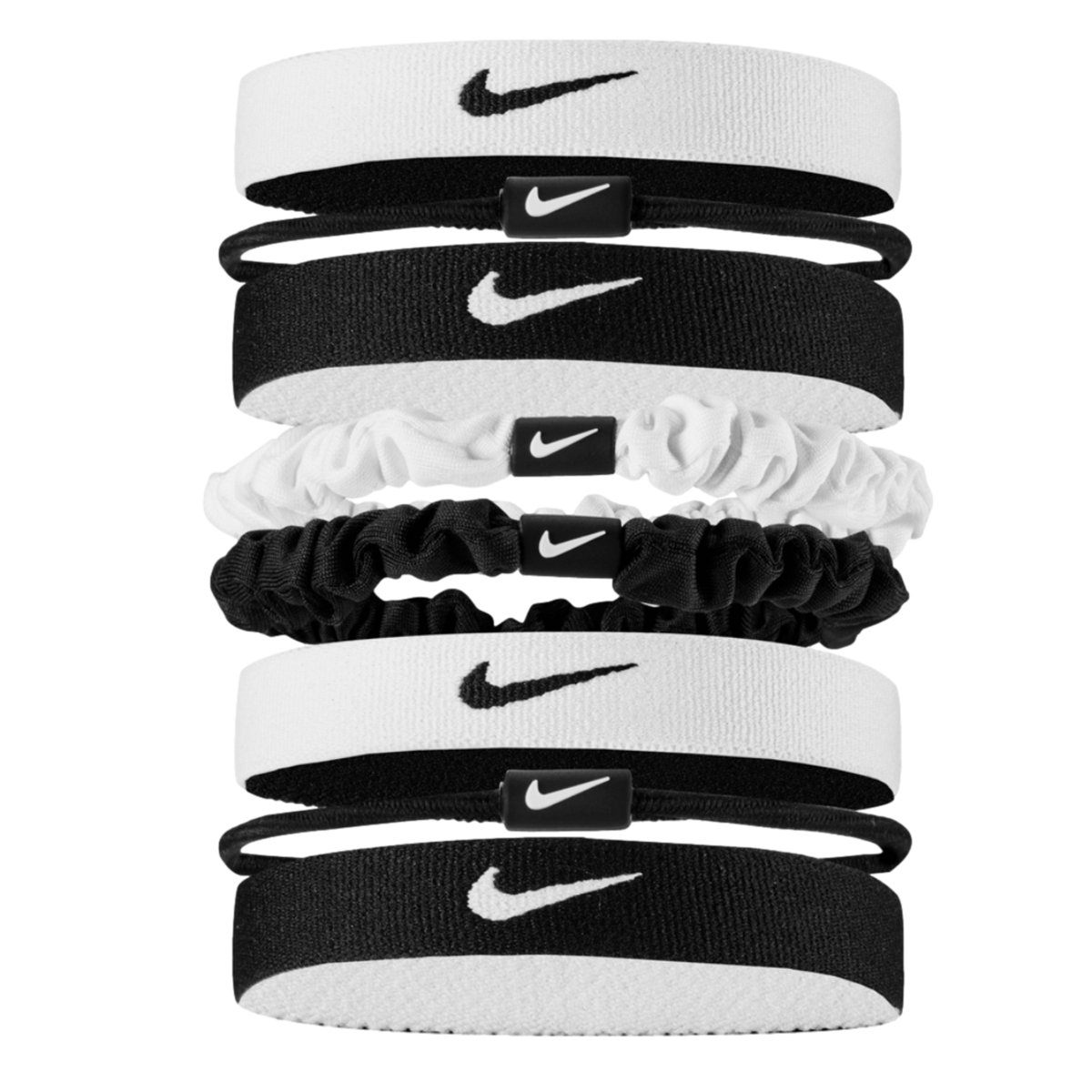 A vertical stack of eight black and white Nike hair accessories, including elastic headbands, thin hair ties, and scrunchies, all featuring the iconic swoosh logo against a black background.