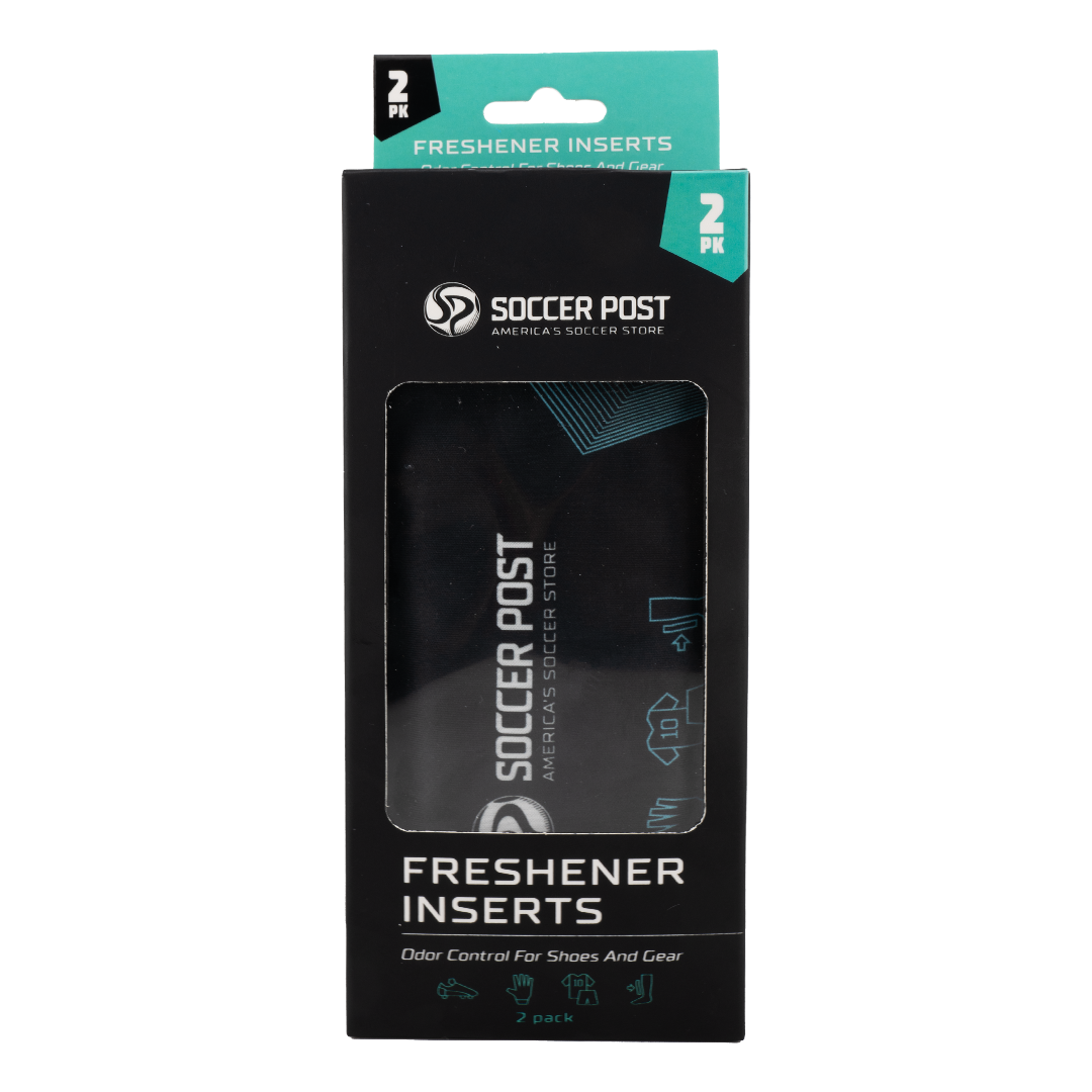 A retail package of Soccer Post Freshener Inserts. The vertical black box features a teal header with "2 PK" and a clear window showing a black fabric insert inside. The Soccer Post logo and tagline, "America's Soccer Store," are printed in white. Text at the bottom reads "FRESHENER INSERTS" and "Odor Control For Shoes And Gear" above icons representing athletic equipment.