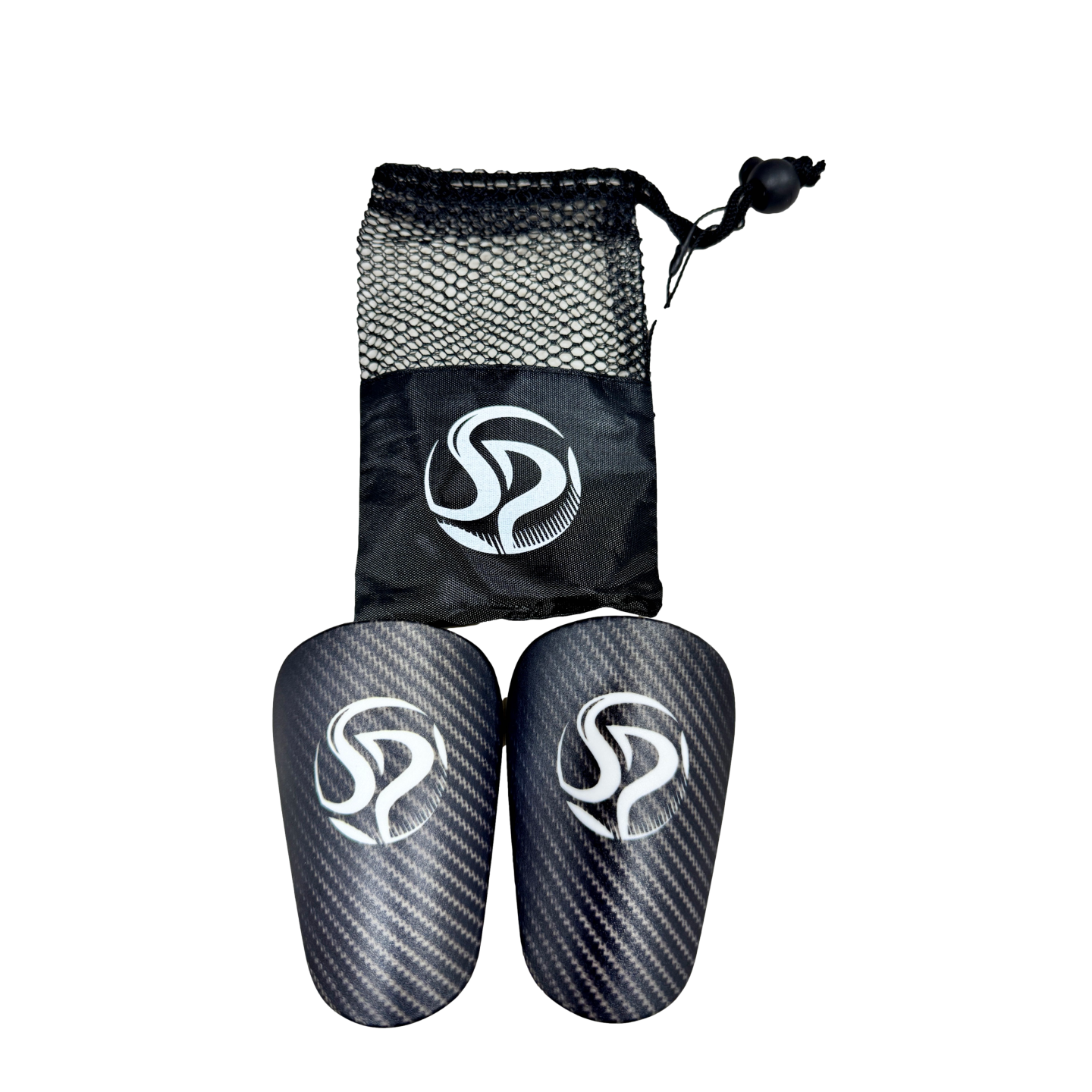 Carbon-fiber-patterned soccer shin guards and a black mesh drawstring bag, both featuring a white "SP" logo, centered on a solid black background.